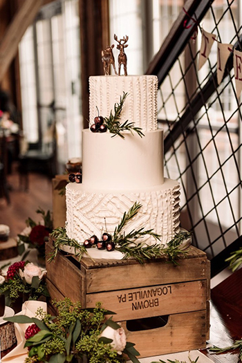 3 Tier buttercream wedding cake decorated with buttercream designs, rose gold painted cherries and fresh greenery, delivered to Wyndridge Farm, Dallastown PA