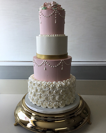 4 Tier blush, ivory and gold buttercream wedding cake decorated with buttercream flowers, delivered to Heritage Hills, York PA