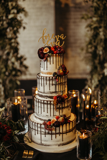 4 Tier semi named wedding cake, decorated with drippy chocolage ganache, fresh flowers and fruit delivered at The Bond in York PA