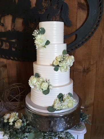 4 Tier textured buttercream wedding cake, decorated with fresh flowers delivered at Lakeview Farms Dover PA