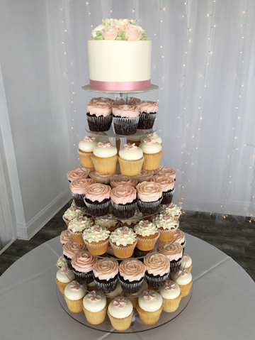 Small wedding cutting cake and displayed on a cupcake stand, delivered at Lauxmont Farms in Wrightsville PA.
