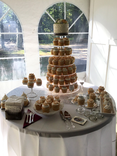 Small wedding cutting cake and and cupcakes displayed on a round cupcake stand. Historic Shady Lane Manchester PA