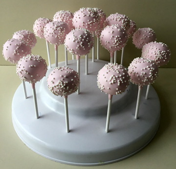 Blush cake pops decorated with white nonpareils.