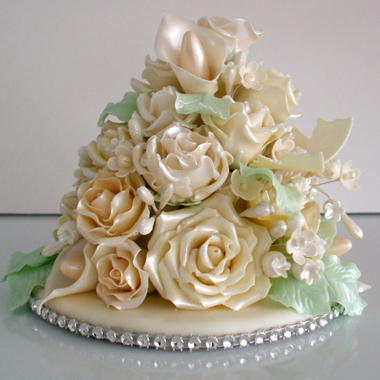Hand made wedding cake topper of assorted off white flowers