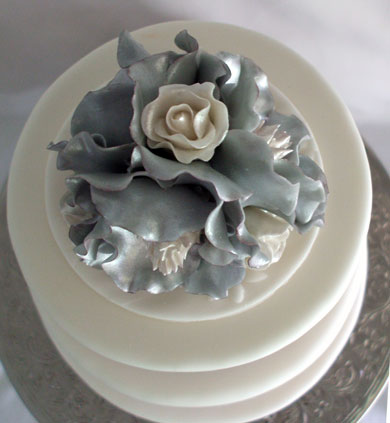 Top view of hand made silver southern magnolia and white roses