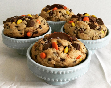 Thick soft center New York style peanut butter Reese's pieces and peanut butter cups chocolate chip cookies, sprinkled with sea salt