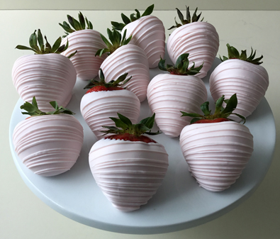 strawberries dipped in light pink blush chocolate