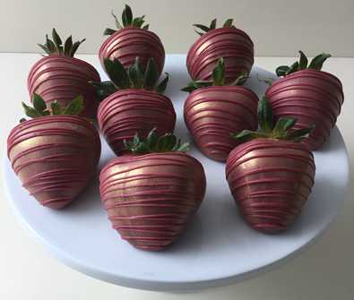 strawberries dipped in wine chocolate with gold highlights