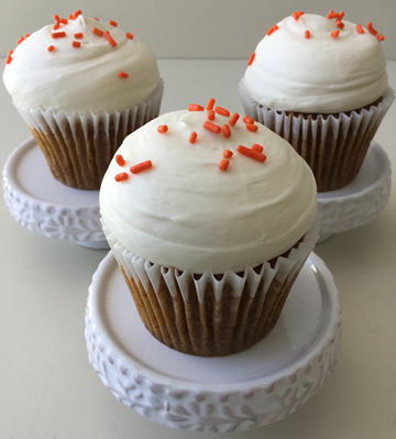 Carrot cupcakes, topped with our famous dollops of cream cheese icing and orange sprinkles