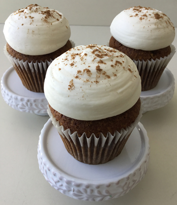 Pumpkin spice cupcakes, topped with our famous dollops of cream cheese icing and dusted with pumpkin pie spice