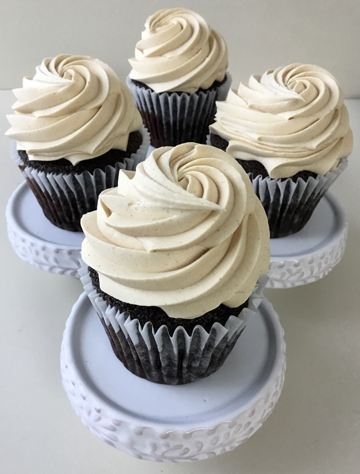 Chocolate cupcakes, topped with peanut buttercream, using a star tip