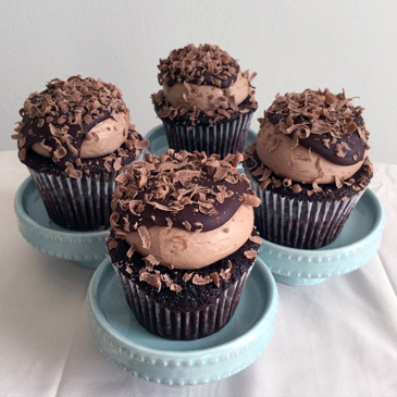 Chocolate cupcakes, filled with ganache, topped with chocolate buttercream, ganache and shaved chocolate
