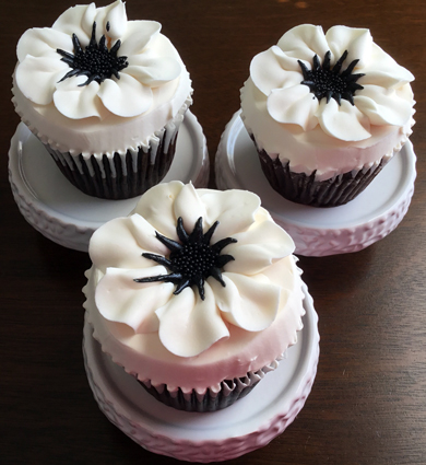 Chocolate cupcakes, filled with peanut buttercream, iced with vanilla buttercream and decorated with buttercream anemones delivered at the Wyndridge Farm Dallastown PA