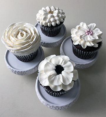 Assorted white floral cupcakes